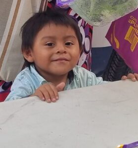 Kid receiving food at soup kitchen